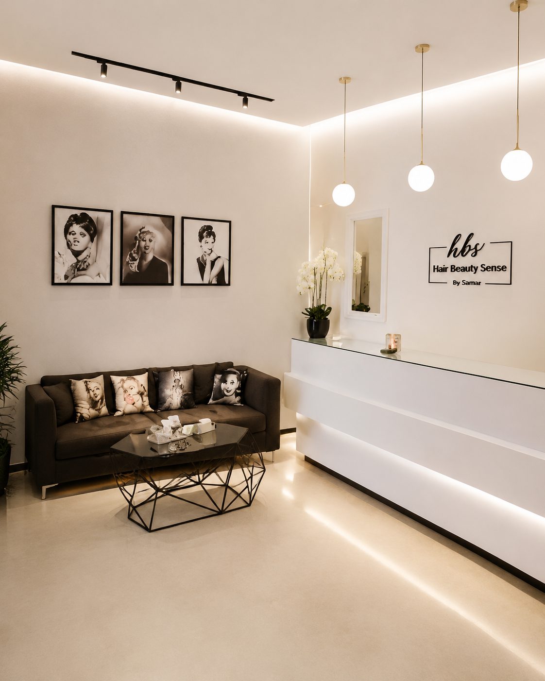 Minimalist hair and beauty salon reception with framed portraits