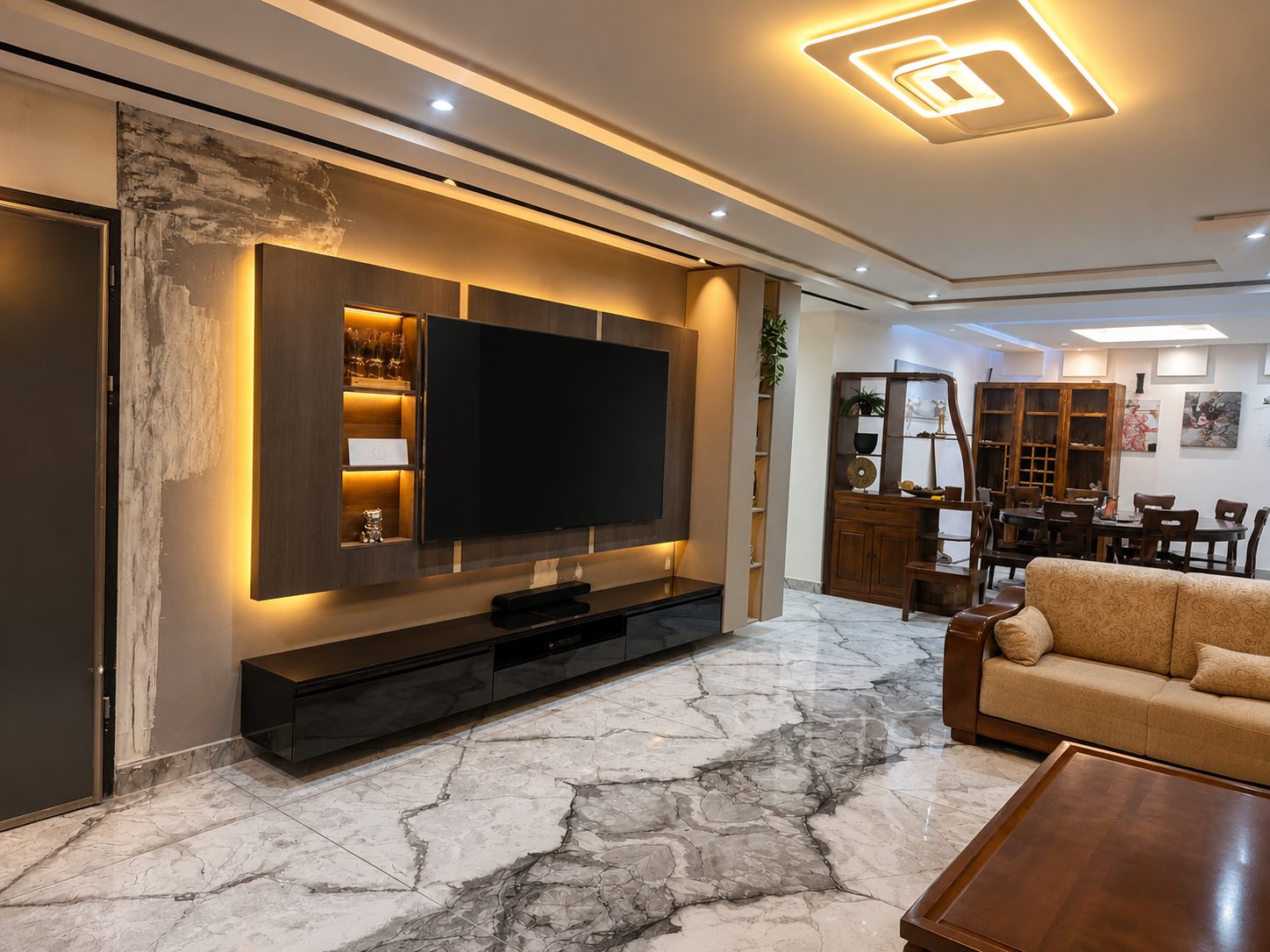 A completed Rita (SL) Ltd luxury living room with marble floors and a backlit media wall